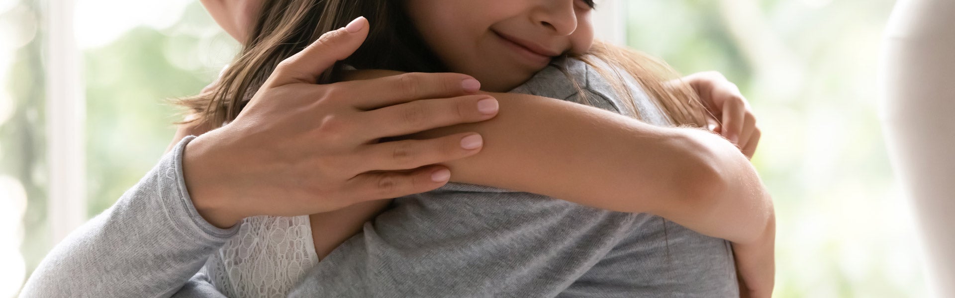 image of a little girl hugging their parent