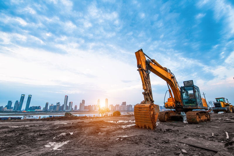 image of a construction site and city skyline